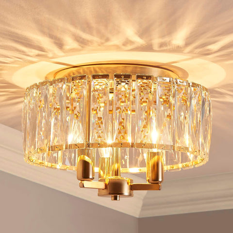 Gold and crystal ceiling light fixture on a neutral background