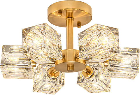 Gold ceiling light fixture with crystal-like glass shades on a white background
