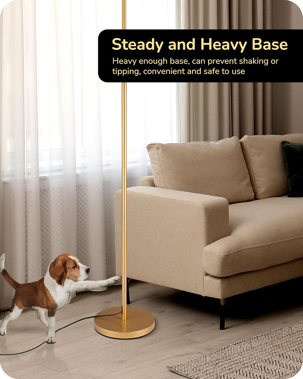 Gold floor lamp with a steady and heavy base in a living room setting.