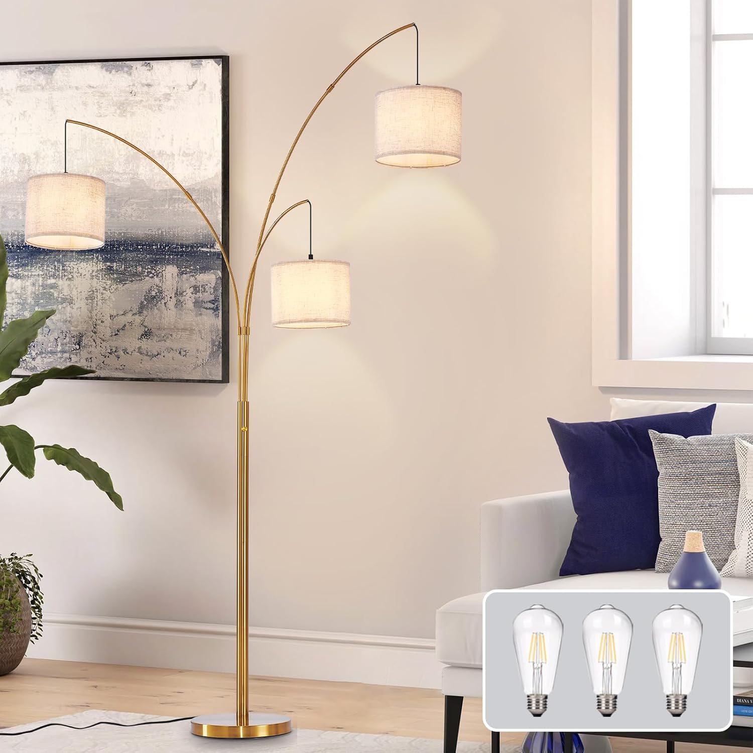 Gold floor lamp with three light bulb illustrations in a living room setting.