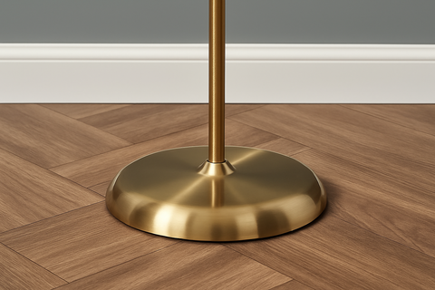Gold metal stand on a wooden floor with a neutral background