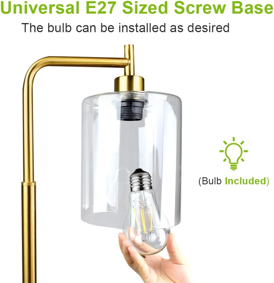 Gold pendant light fixture with clear glass shade and bulb included, on a white background.