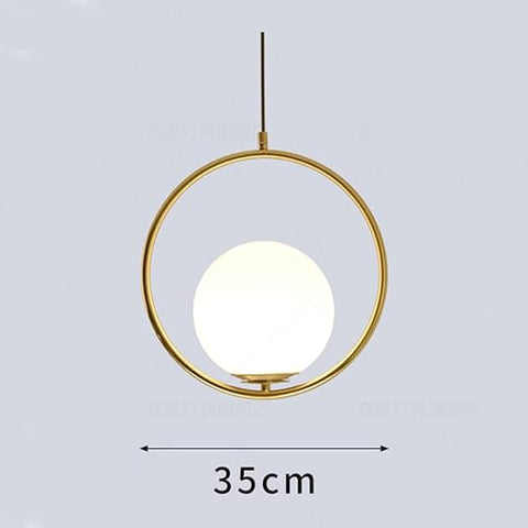 Gold pendant light with a white bulb on a gray background, showing dimensions.