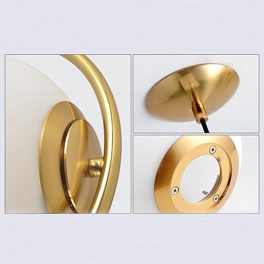 Gold wall sconce with close-up details on a white background