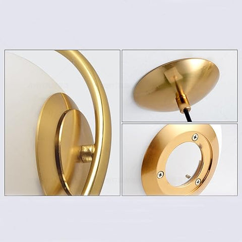 Gold wall sconce with close-up details on a white background