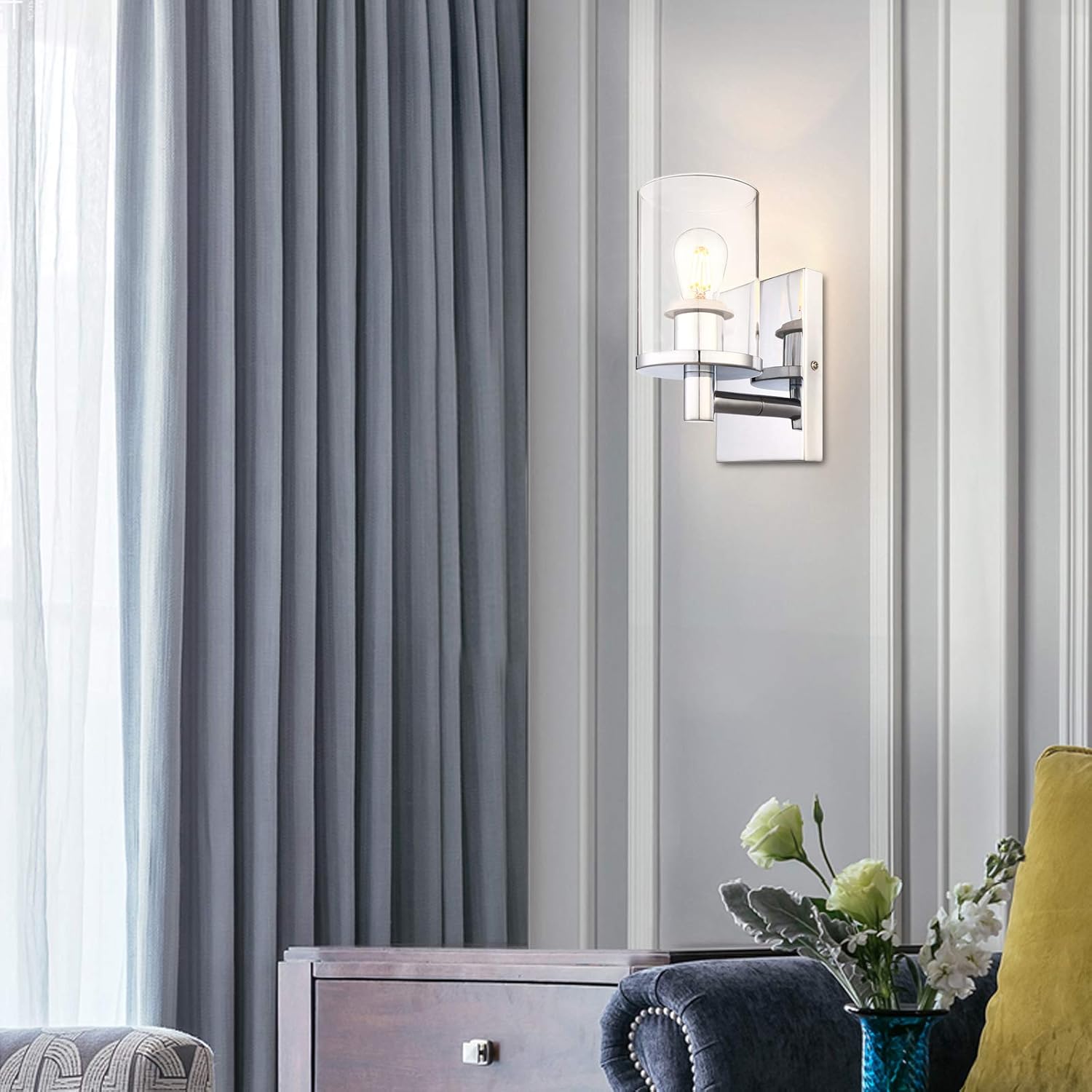 Gray striped curtains in a room with a lamp and decorative elements.
