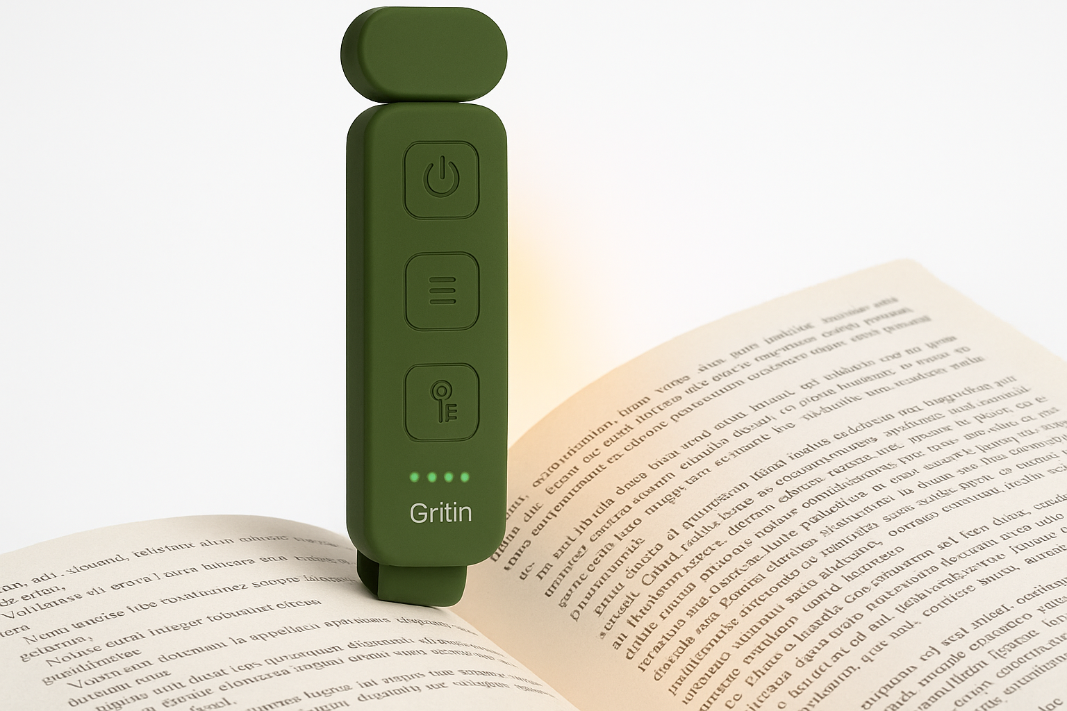 Green Gritin device on an open book with a white background