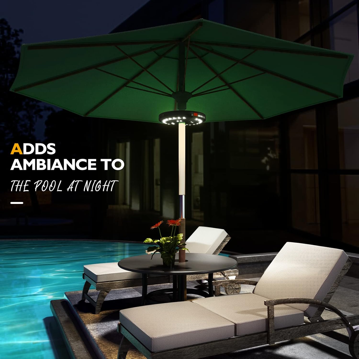 Green patio umbrella with built-in light over outdoor seating area by a pool at night.