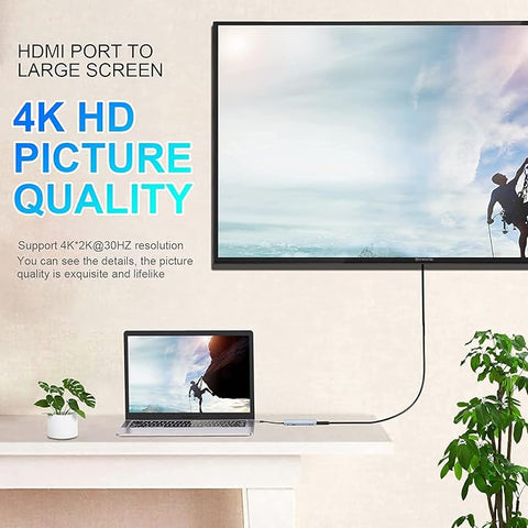 HDMI cable connecting a laptop to a TV displaying a 4K HD picture quality.