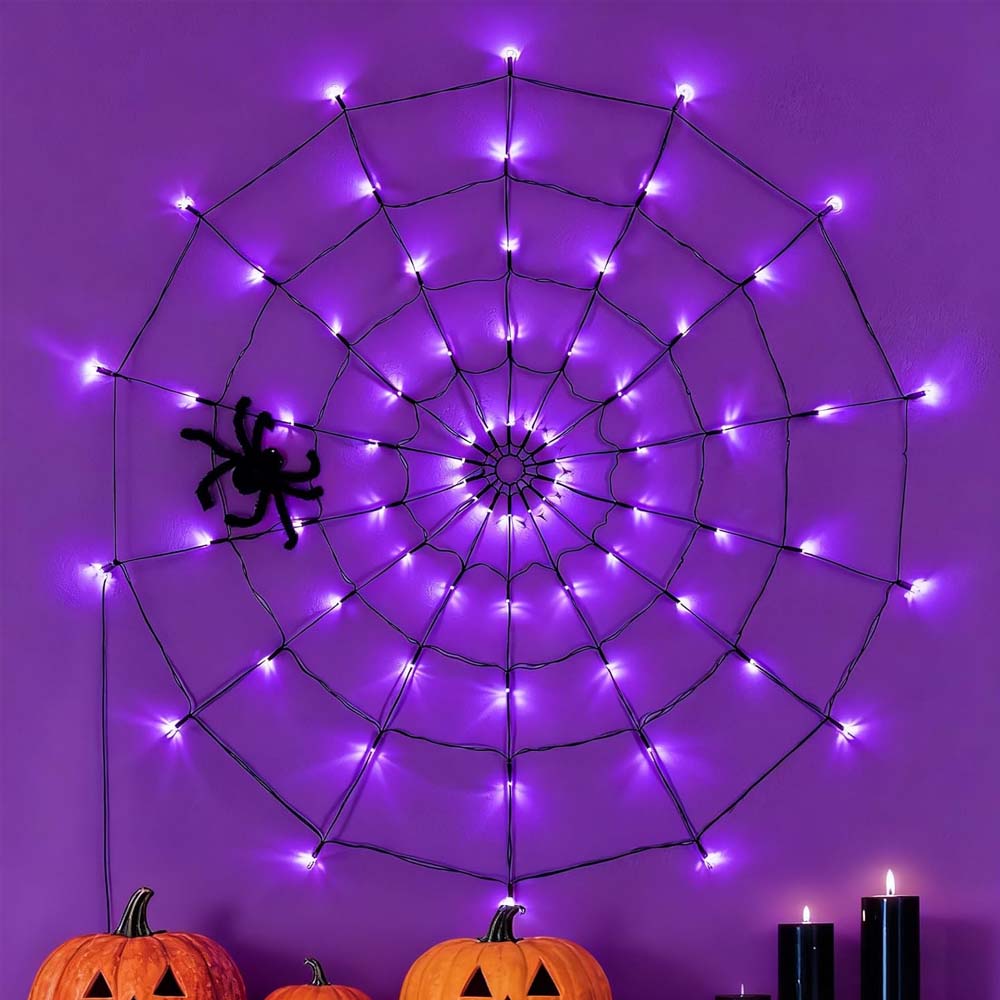 Halloween-themed string lights with pumpkin design against a dark background