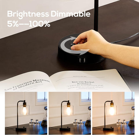 Hand adjusting a dimmable lamp on a table with a book open below.