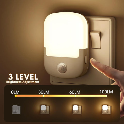 Hand adjusting a night light switch with brightness adjustment feature on a warm background
