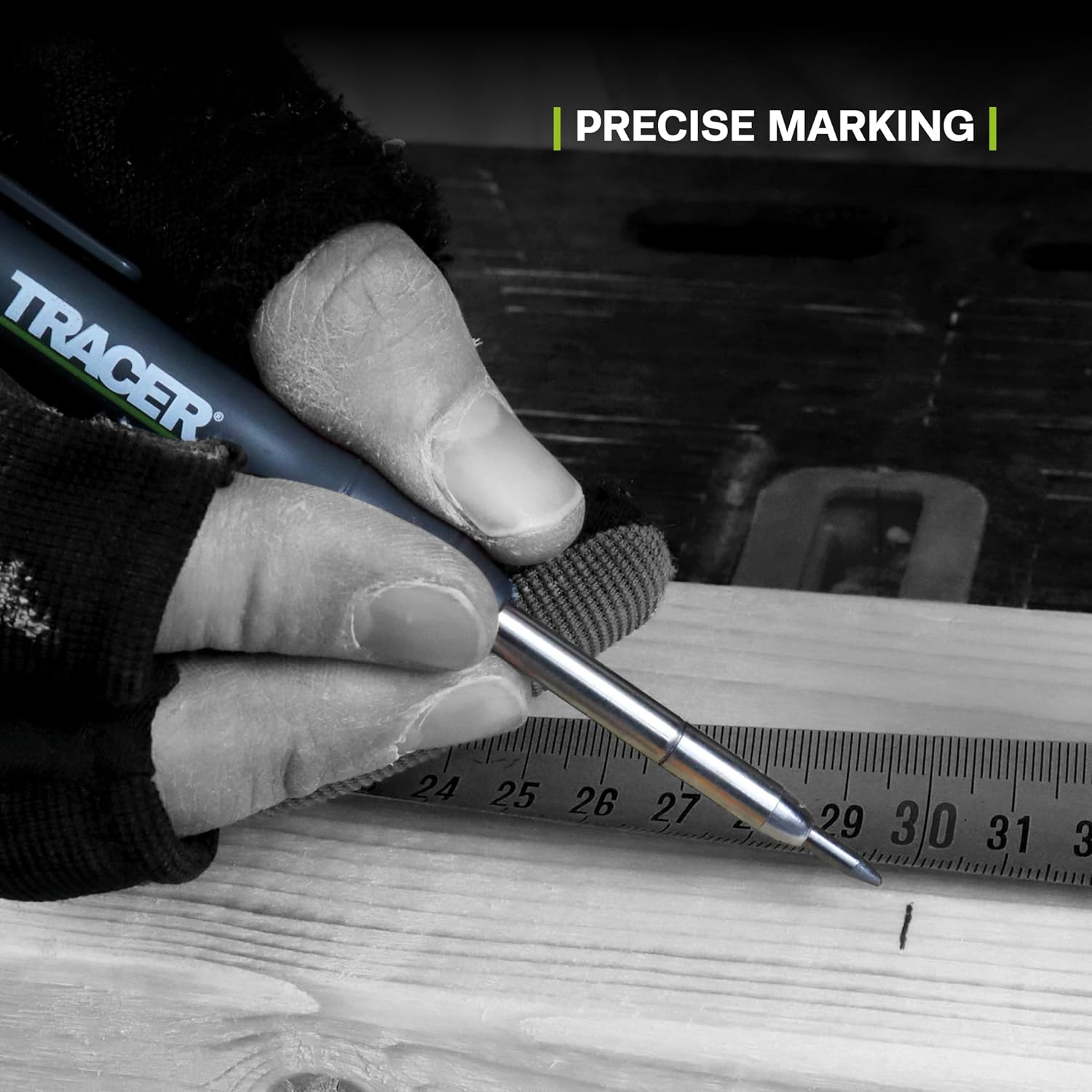 Hand holding a TRACER pen with a metal tip, marking a piece of wood, with 'PRECISE MARKING' text above.