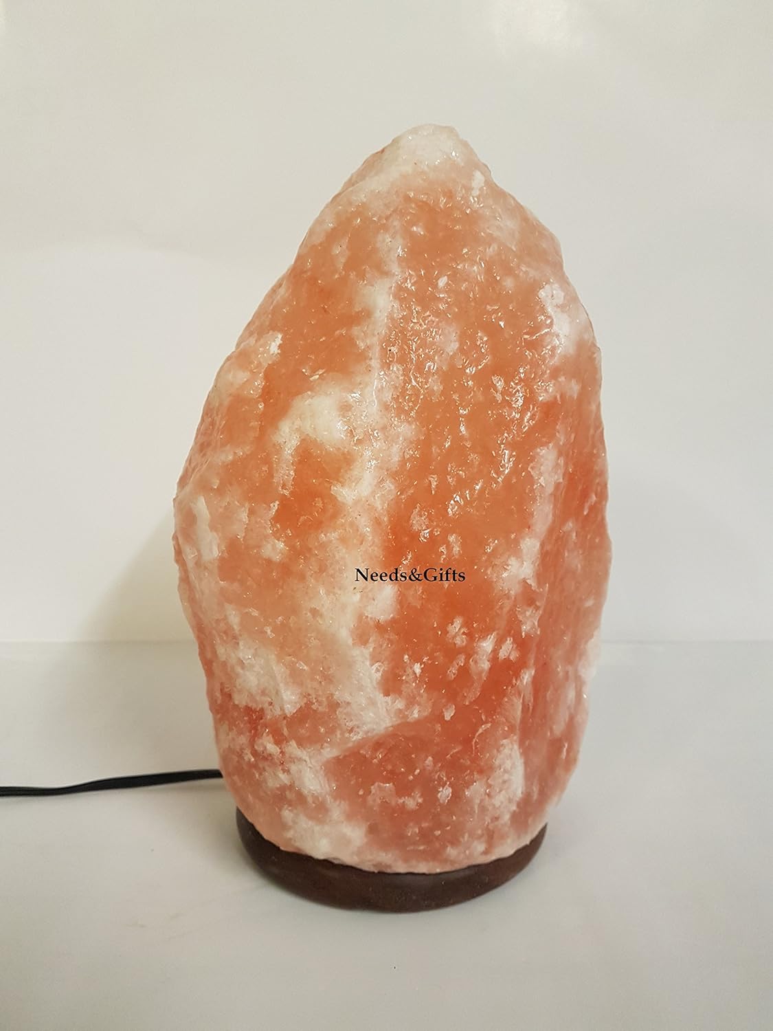 Himalayan salt lamp on a white background with 'Needs & Gifts' branding.