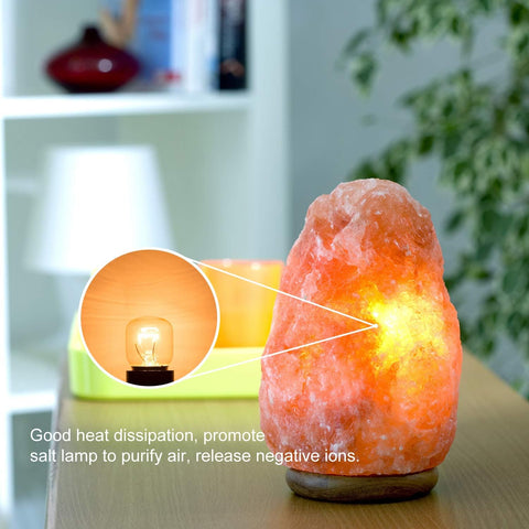 Himalayan salt lamp on a wooden surface with text about air purification.