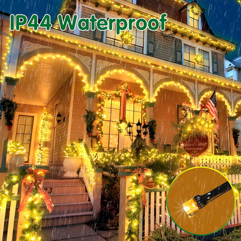House exterior decorated with IP44 waterproof string lights during a snowfall.