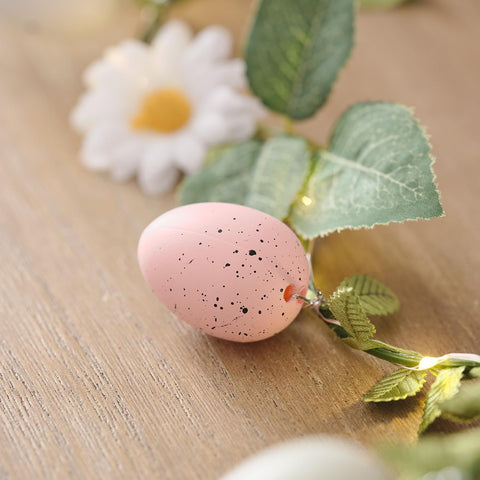 Indoor Easter egg fairy lights on bookshelf
