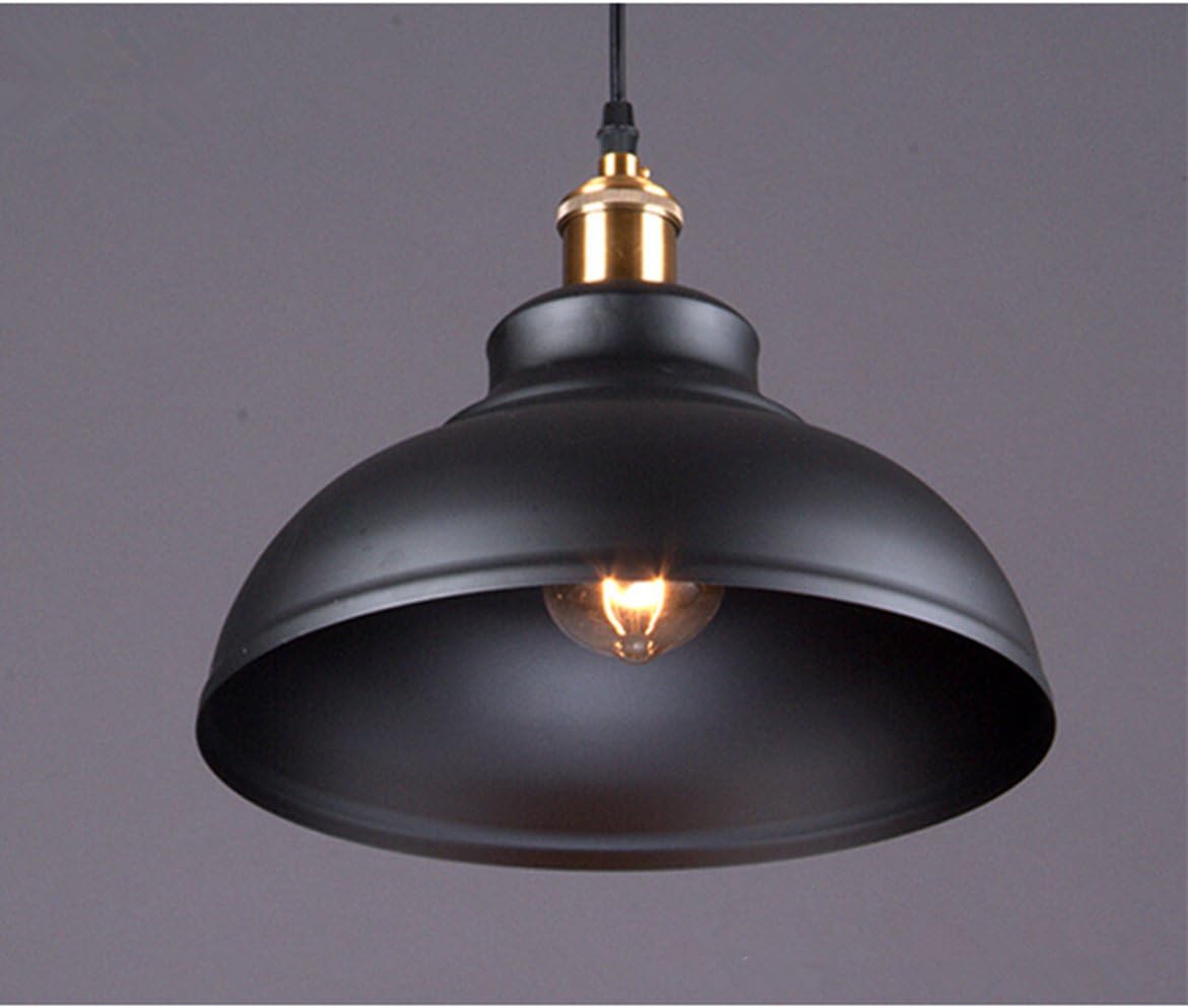 Retro iron pendant light illuminating a modern loft space

