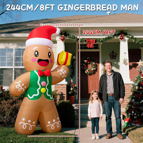 Inflatable gingerbread man decoration in front of a house with a man and child standing next to it.