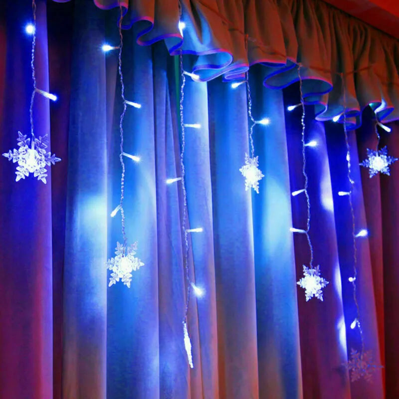 Plug-in Christmas curtain lights with snowflake shapes

