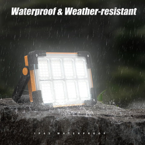 LED work light on a stone surface with rain falling, emphasizing waterproof feature.