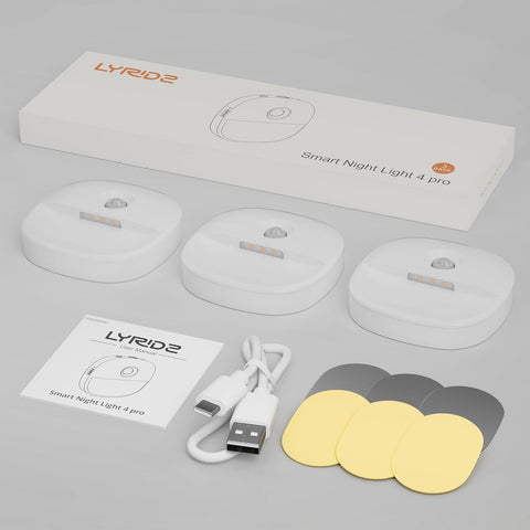 LYRIDE Smart Night Light 4 pro packaging with light bulbs, USB cable, and color filters on a gray background