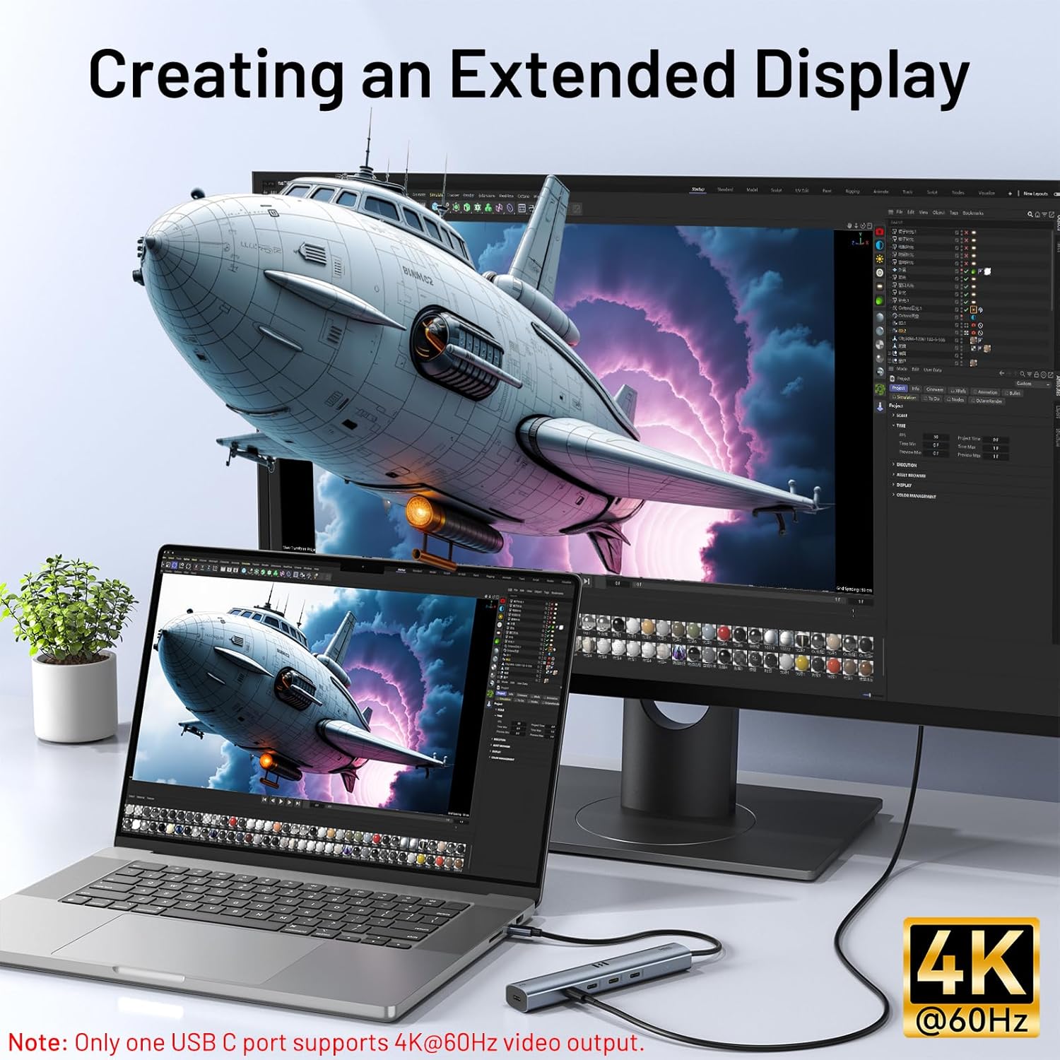 Laptop and monitor setup with extended display, showing a spaceship image.