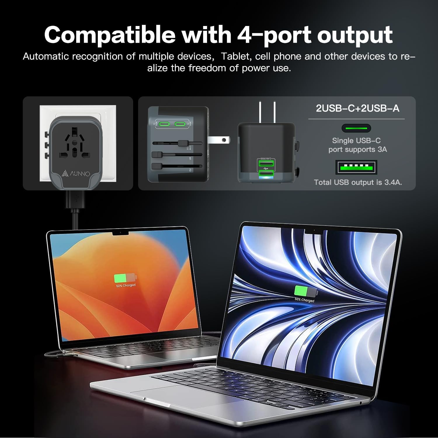 Laptop charging with a power adapter and multiple devices on a dark background