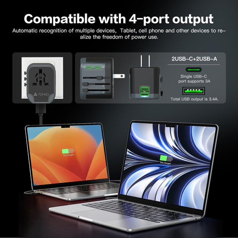 Laptop charging with a power adapter and multiple devices on a dark background