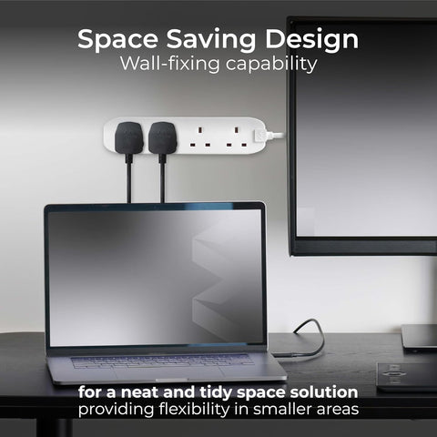 Laptop on a desk with a power strip and monitor, emphasizing space-saving design.
