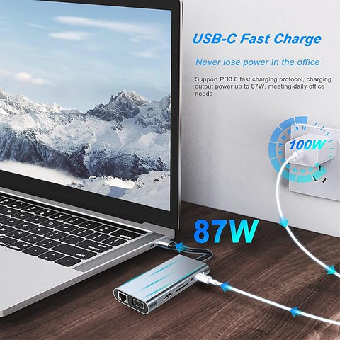 Laptop with USB-C fast charging device on a wooden surface, showing a mountainous landscape on screen.