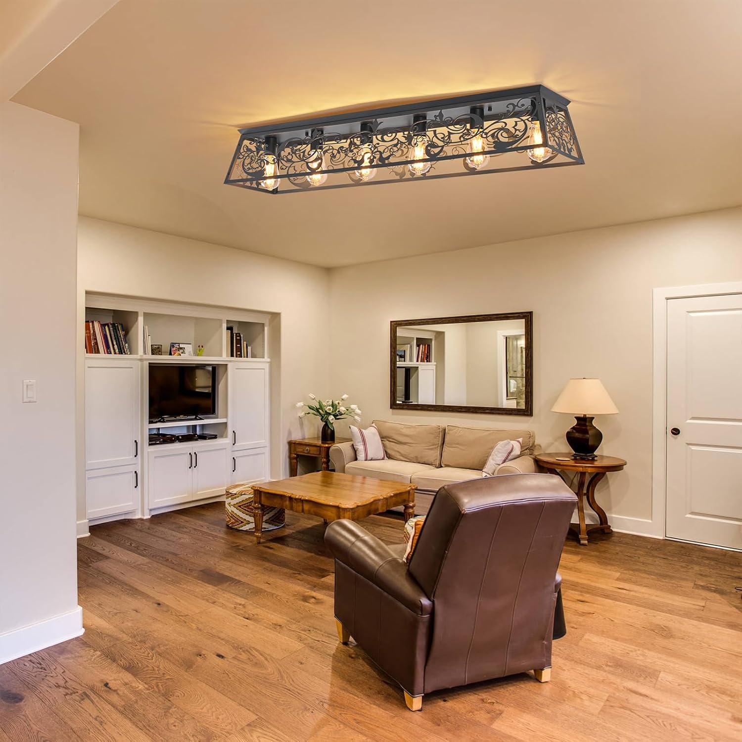 Living room with a ceiling light fixture, sofa, coffee table, and armchair.