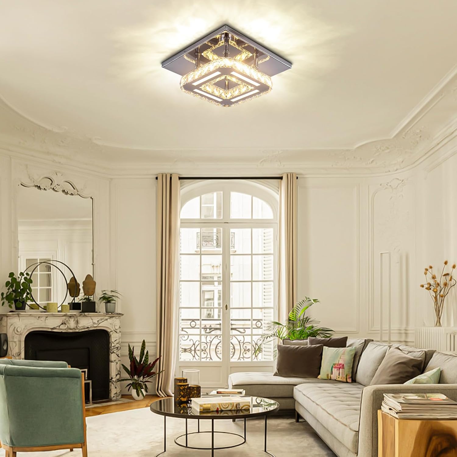 Living room with a modern ceiling light fixture, sofa, and decorative elements.