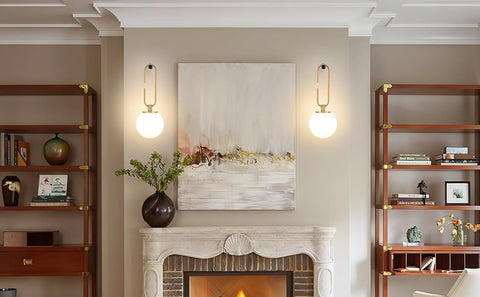 Living room with fireplace, shelves, and wall art