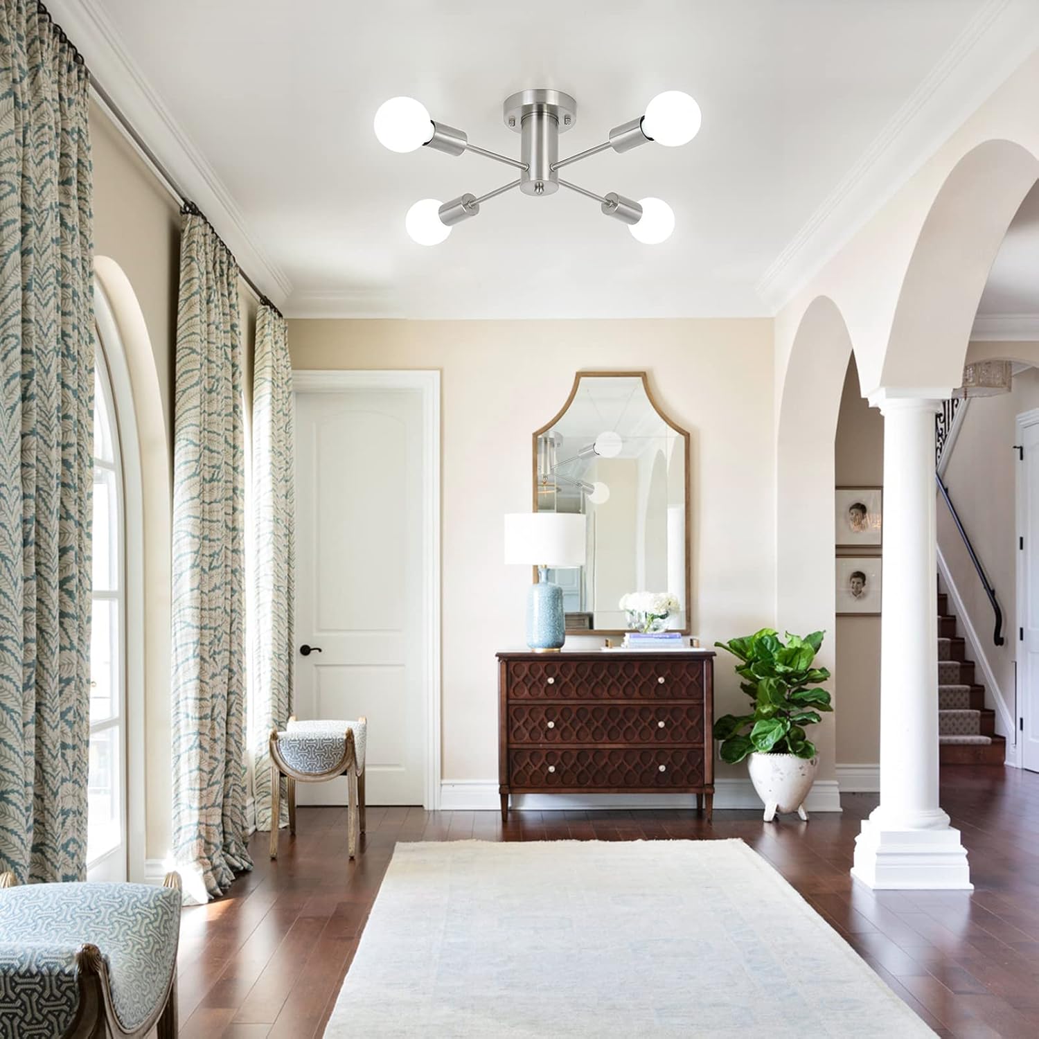 Living room with wooden dresser, mirror, and decorative elements.
