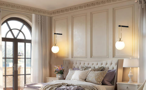 Luxurious bedroom with elegant decor, including a bed with pillows, nightstands, and wall lights.