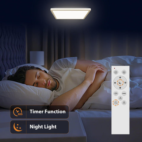 Man sleeping in bed with a ceiling light and remote control in a dark room
