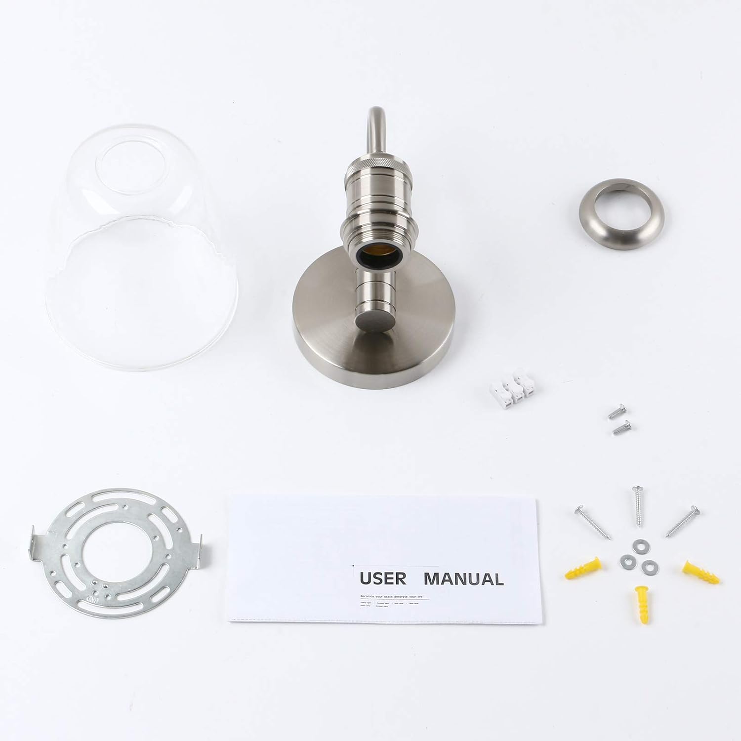 Metallic faucet assembly with parts and user manual on a white background