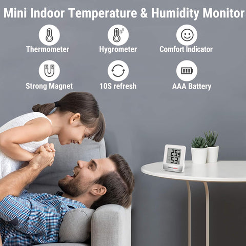 Mini indoor temperature and humidity monitor with family in the background
