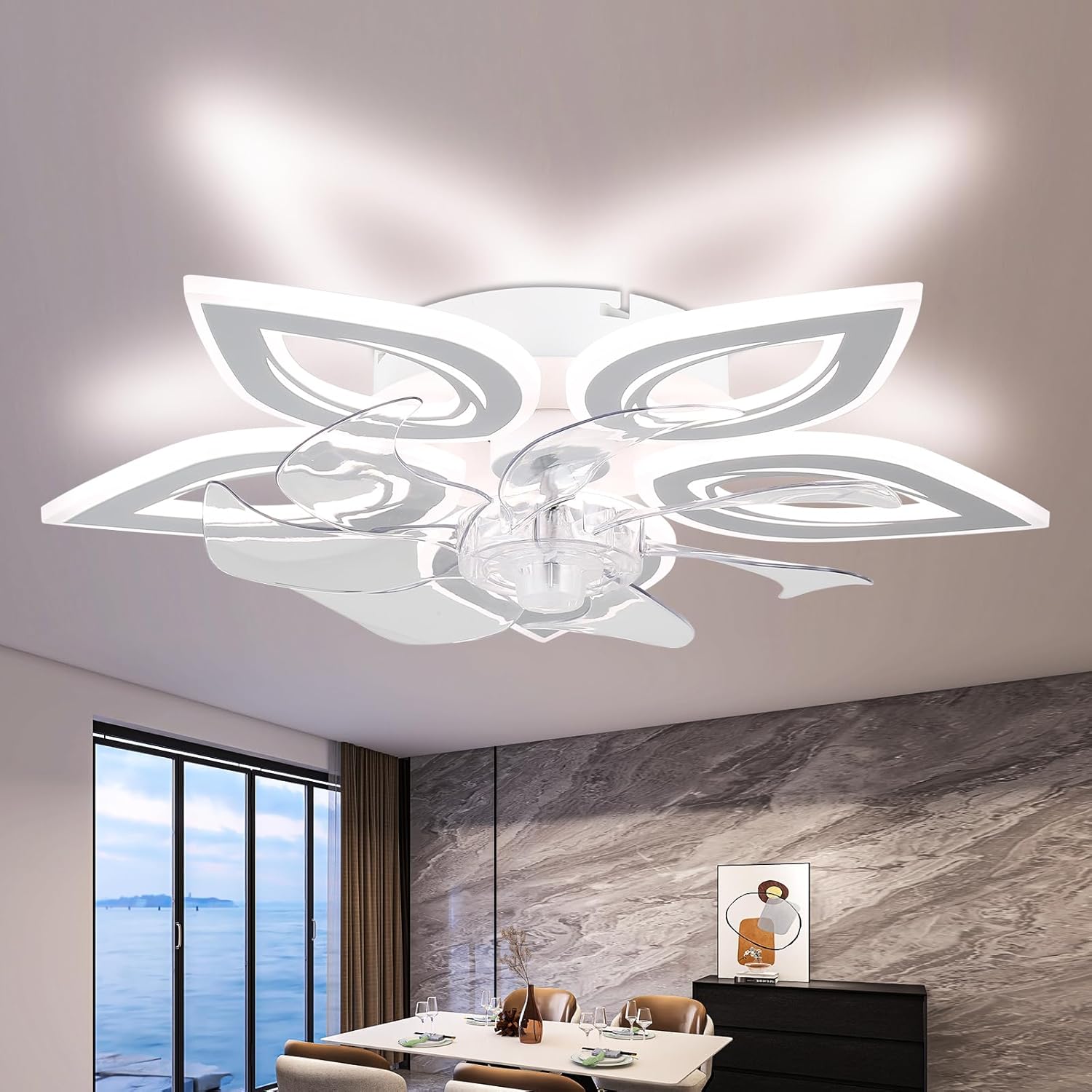 Modern ceiling light fixture in a room with a large window and decor elements.