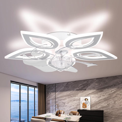 Modern ceiling light fixture in a room with a large window and decor elements.