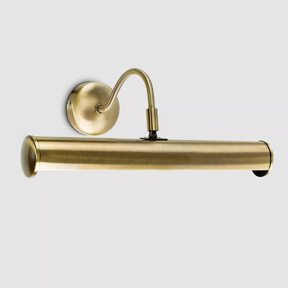 Twin display lamp in satin nickel finish illuminating a living room wall​
