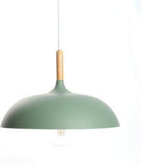 Industrial pendant light fixture in a contemporary bar setting.

