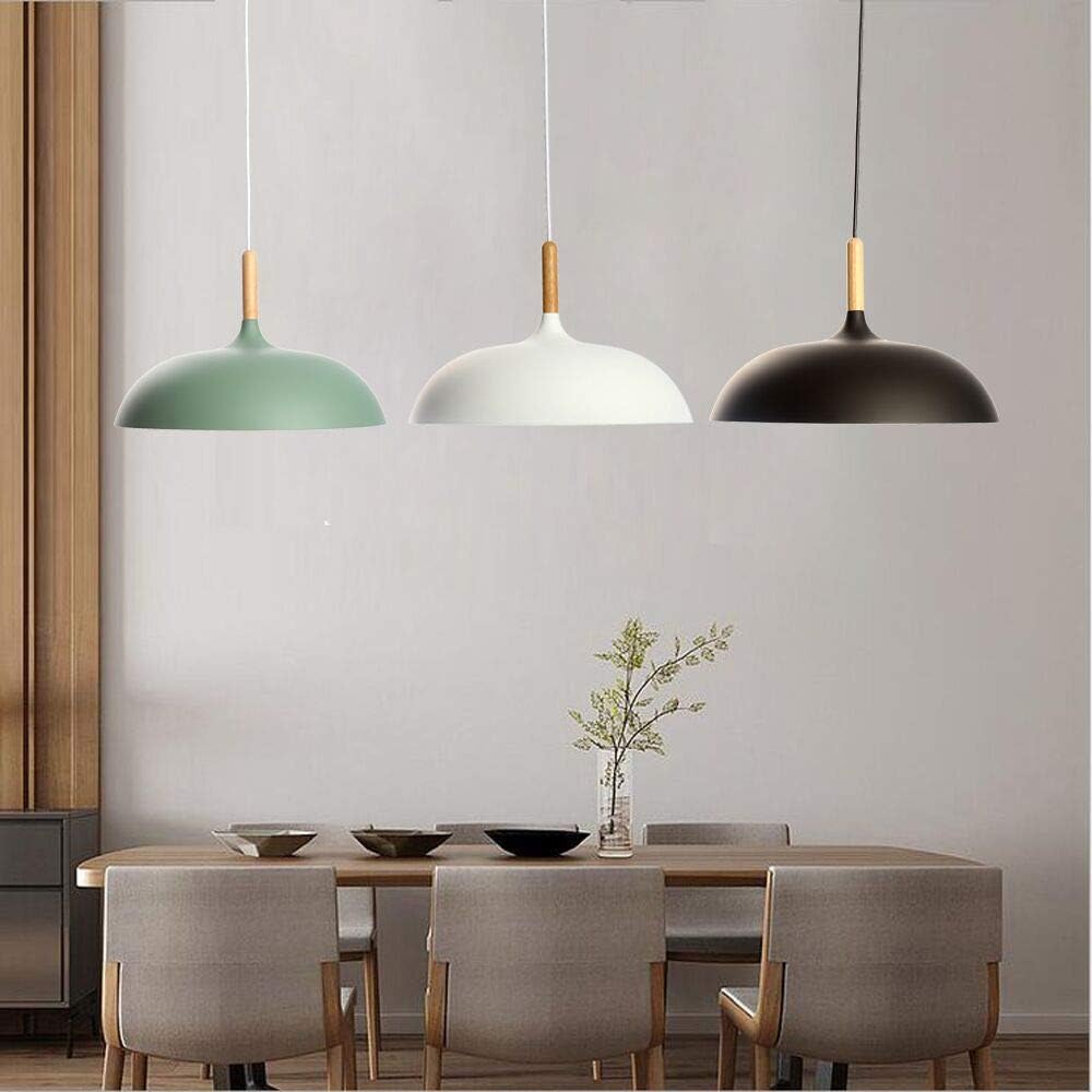 Industrial pendant light fixture in a contemporary bar setting.

