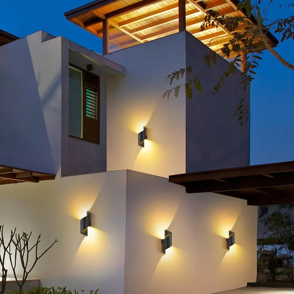 Close-up of the black exterior and gold interior of the wall light

