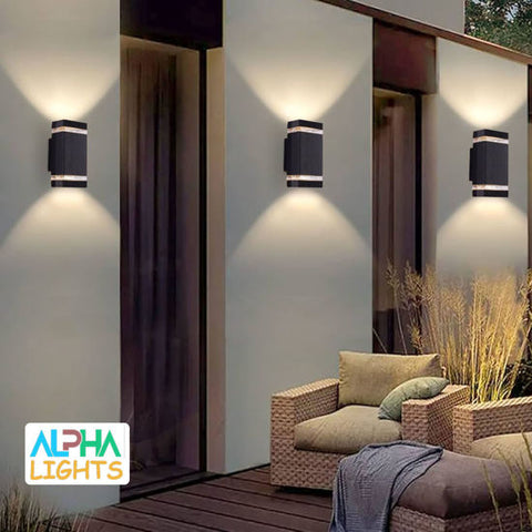 Outdoor wall light illuminating a patio entrance at night