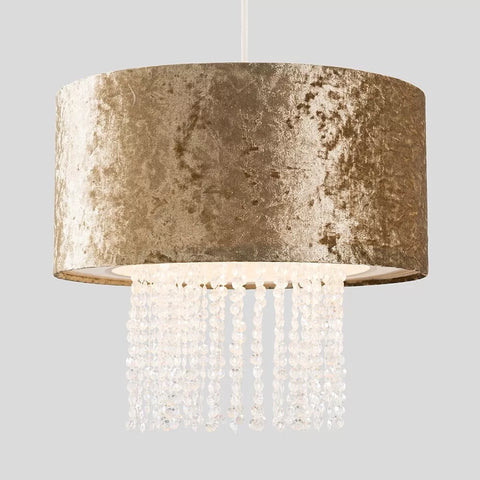 Acrylic droplets hanging from modern velvet pendant light


