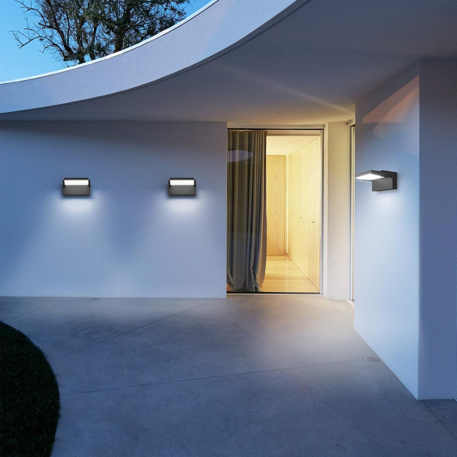 Modern architectural design with illuminated interior and wall lights.