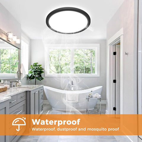 Modern bathroom with a freestanding bathtub, sink, and large window. Waterproof feature highlighted.