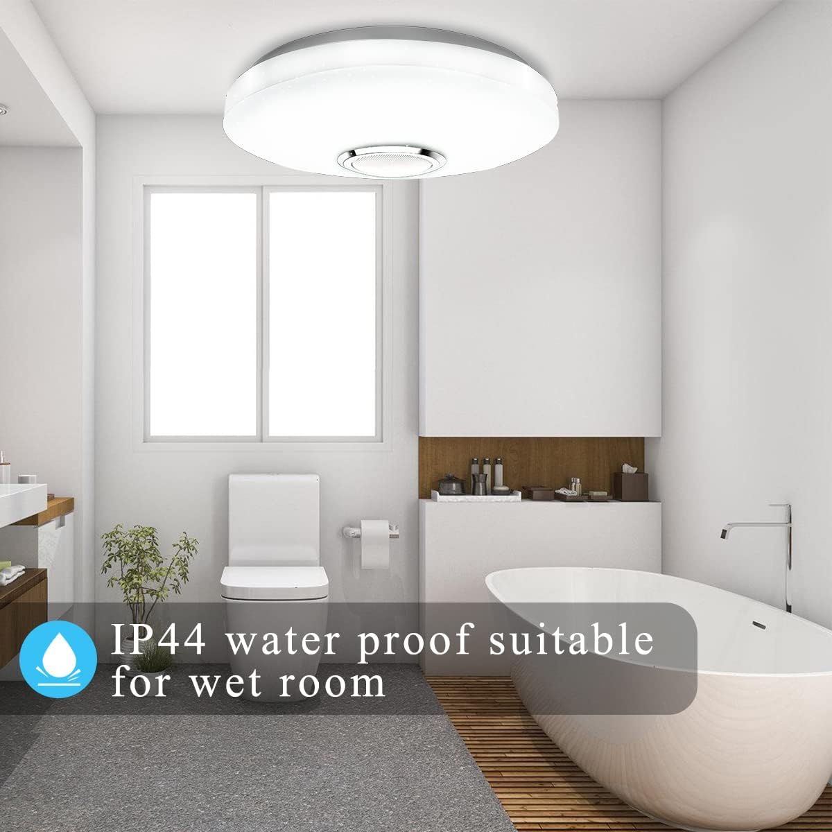 Modern bathroom with a white bathtub, toilet, and sink, featuring IP44 water-proof text.